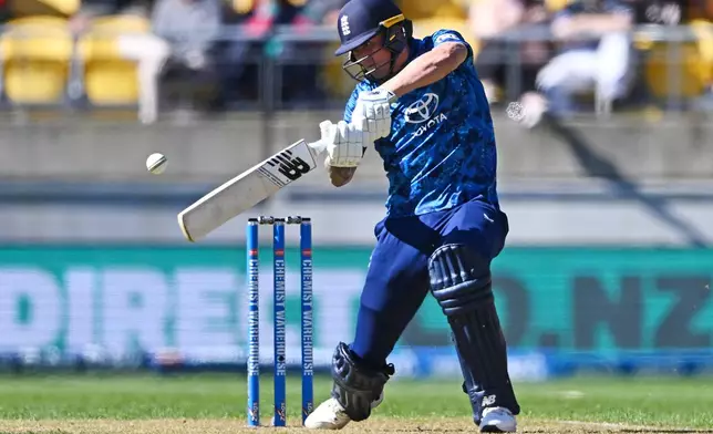 Brydon Carse of England bats during the One Day International cricket match between New Zealand and England in Wellington, New Zealand, Saturday, Nov. 1, 2025. (Kerry Marshall/Photosport via AP)
