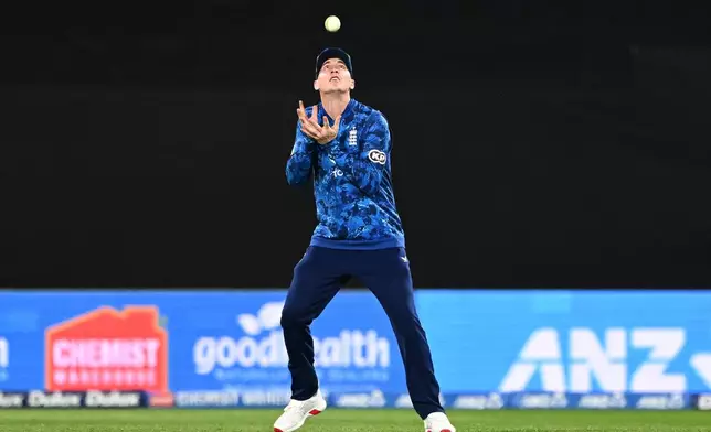 Harry Brook of England takes a catch to dismiss Mitchell Santner of New Zealand during the One Day International cricket match between New Zealand and England in Wellington, New Zealand, Saturday, Nov. 1, 2025. (Kerry Marshall/Photosport via AP)