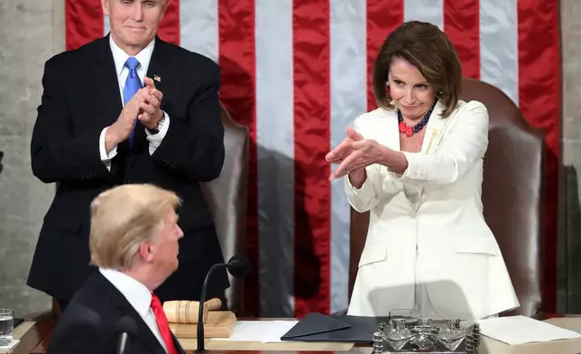 FILE - President Donald Trump turns to House speaker Nancy Pelosi of Calif., as he delivers his State of the Union address to a joint session of Congress on Capitol Hill in Washington, as Vice President Mike Pence watches, Feb. 5, 2019. (AP Photo/Andrew Harnik File)