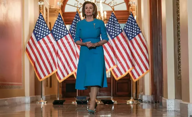 FILE - House Speaker Nancy Pelosi of Calif., arrives to speak about the House coronavirus bill on Capitol Hill in Washington, March, 13, 2020. (AP Photo/Scott Applewhite, File)