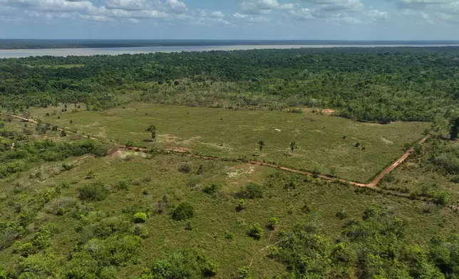 A proposed landfill, front, is visible near a quilombola, an Afro-descendant community called Menino Jesus in Acara, Brazil, Tuesday, Nov. 18, 2025. (AP Photo/Fernando Llano)