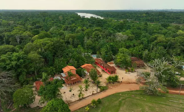 Houses at a quilombola, an Afro-descendant community called Menino Jesus, are visible in Acara, Brazil, Tuesday, Nov. 18, 2025. (AP Photo/Fernando Llano)
