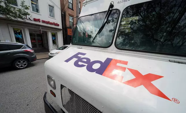 FILE - A FedEx truck makes deliveries in Pittsburgh on Wednesday, June 25, 2025. (AP Photo/Gene J. Puskar, File)
