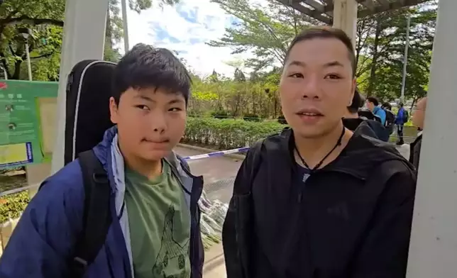 Mr. Chow and his teenage son, Photo by Bastille Post