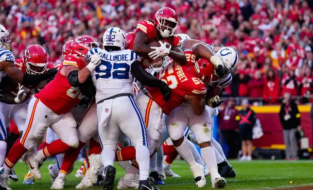 Kansas City Chiefs running back Kareem Hunt (29) leaps for a touchdown against the Indianapolis Colts during the second half of an NFL football game Sunday, Nov. 23, 2025, in Kansas City, Mo. (AP Photo/Charlie Riedel)