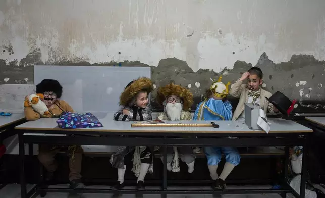 Ultra-Orthodox Jewish children dress up in costumes during school ahead of the Jewish holiday of Purim, in Jerusalem, March 12, 2025. (AP Photo/Ohad Zwigenberg, File)