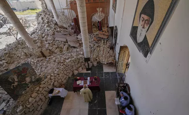 Worshippers gather for Easter Mass inside the ruins of St. George Melkite Catholic Church, damaged by Israeli airstrike, in Dardghaya, southern Lebanon, April 20, 2025. (AP Photo/Hassan Ammar, File)