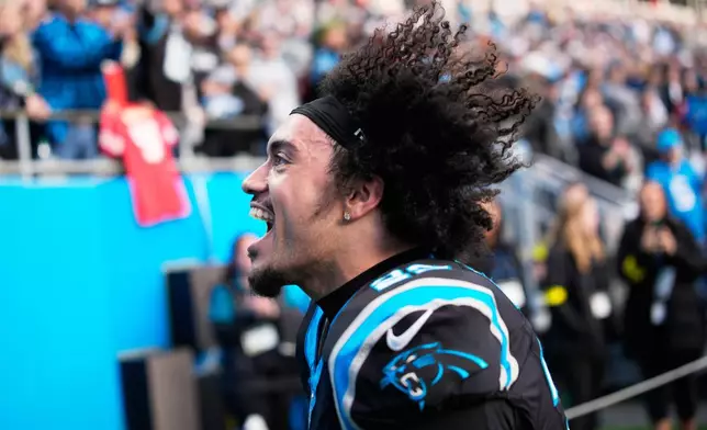 Carolina Panthers safety Lathan Ransom celebrates after their win in an NFL football game between the Carolina Panthers and the Tampa Bay Buccaneers, Sunday, Dec. 21, 2025, in Charlotte, N.C. (AP Photo/Jacob Kupferman)