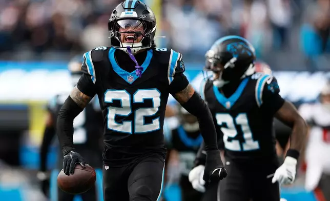 Carolina Panthers safety Lathan Ransom celebrates after and interception against the Tampa Bay Buccaneers during the second half of an NFL football game, Sunday, Dec. 21, 2025, in Charlotte, N.C. (AP Photo/Rusty Jones)