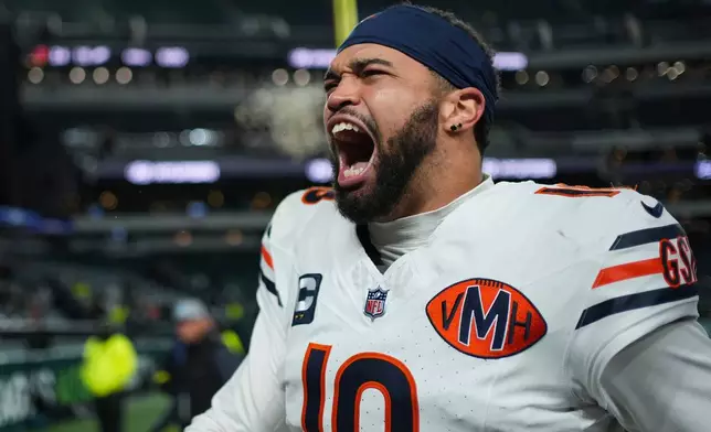Chicago Bears quarterback Caleb Williams (18) celebrates his team's win over the Philadelphia Eagles in an NFL football game, Friday, Nov. 28, 2025, in Philadelphia. (AP Photo/Matt Slocum)