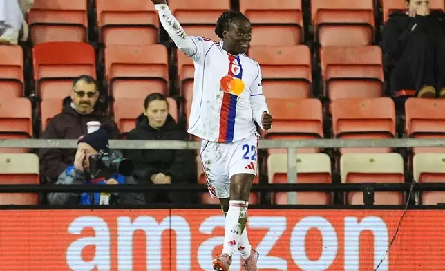 OL Lyonnes' Tabitha Chawinga celebrates scoring their side's first goal during a women's Champions League soccer match against Manchester United, Wednesday, Dec. 10, 2025, in Leigh, England. (Martin Rickett/PA via AP)