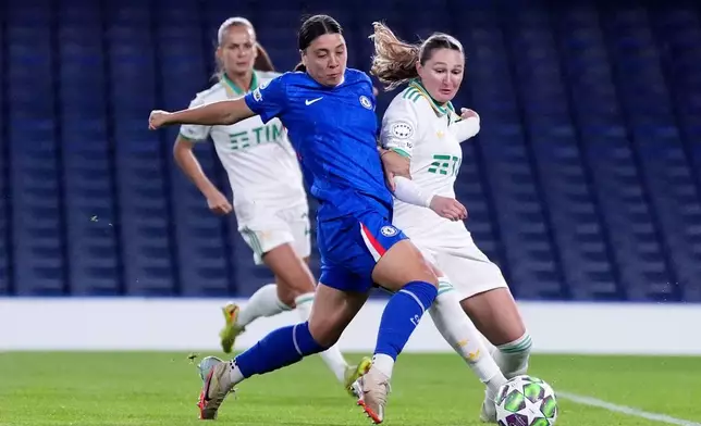 Roma's Winonah Heatley, right, and Chelsea's Sam Kerr in action during the Women's Champions League soccer match between Chelsea and Roma at Stamford Bridge, London, Wednesday Dec. 10, 2025. (Adam Davy/PA via AP)