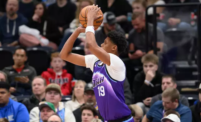 Utah Jazz guard Ace Bailey shoots a three point shot during the second half of an NBA basketball game against the Orlando Magic, Saturday, Dec. 20, 2025, in Salt Lake City. (AP Photo/Tyler Tate)