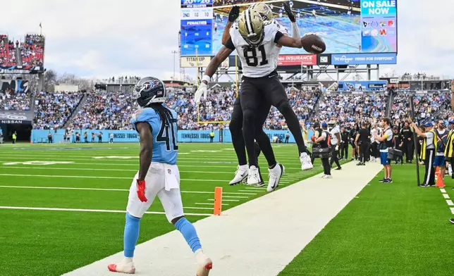 New Orleans Saints wide receiver Kevin Austin Jr. (81) celebrates his touchdown reception in the second half of an NFL football game against the Tennessee Titans, Sunday, Dec. 28, 2025, in Nashville, Tenn. (AP Photo/John Amis)