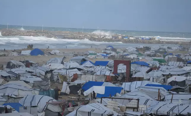 A temporary camp for displaced Palestinians on the beach, near the port of Gaza City, Sunday, Dec. 28, 2025. (AP Photo/Jehad Alshrafi)