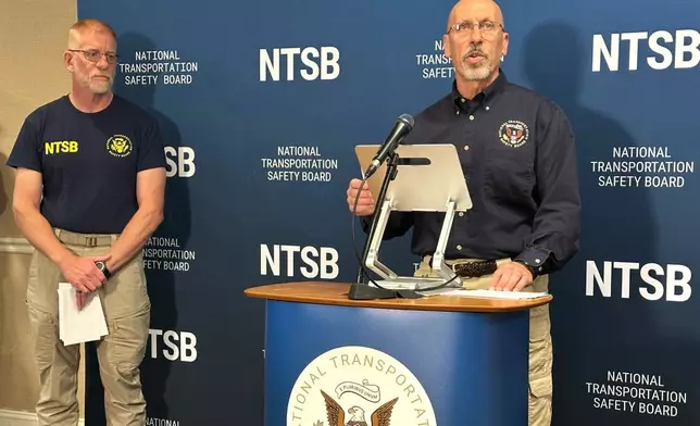 National Transportation Safety Board member Michael Graham, right, speaks at a media briefing on the fatal plane crash that killed former NASCAR driver Greg Biffle and his family, while NTSB investigator Dan Baker listens on Friday, Dec. 19, 2025, in Statesville, N.C. (AP Photo/Gary D. Robertson)