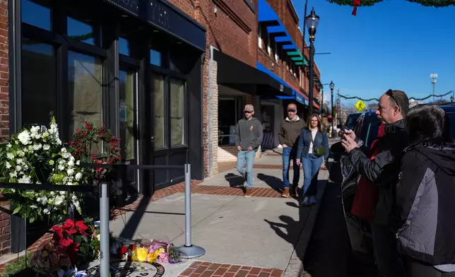 Supporters gather at the tribute next to the NC Auto Racing Walk of Fame for Greg Biffle, Friday, Dec. 19, 2025, in Mooresville, N.C. (AP Photo/Matt Kelley)