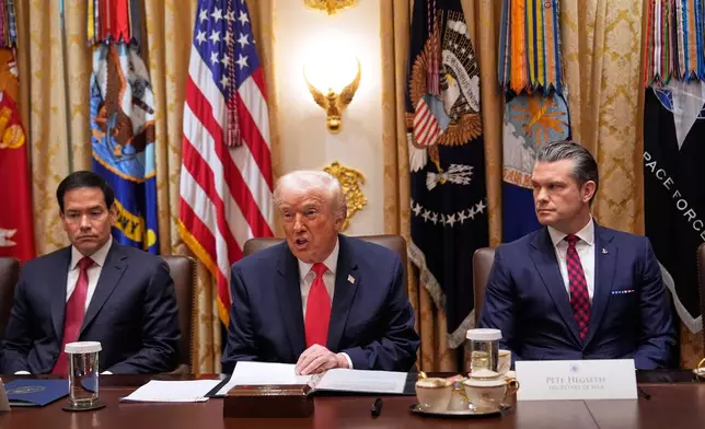President Donald Trump speaks during a Cabinet meeting at the White House, Tuesday, Dec. 2, 2025, in Washington, as Secretary of State Marco Rubio, left, and Defense Secretary Pete Hegseth, right, look on. (AP Photo/Julia Demaree Nikhinson)