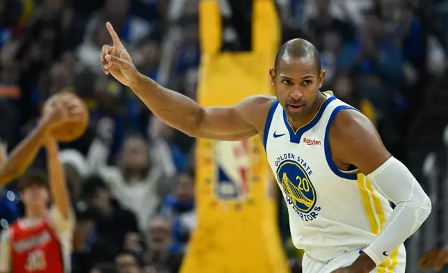Golden State Warriors center Al Horford celebrates a three-point basket against the Dallas Mavericks during the first half of an NBA basketball game, Thursday, Dec. 25, 2025, in San Francisco. (AP Photo/Eakin Howard)