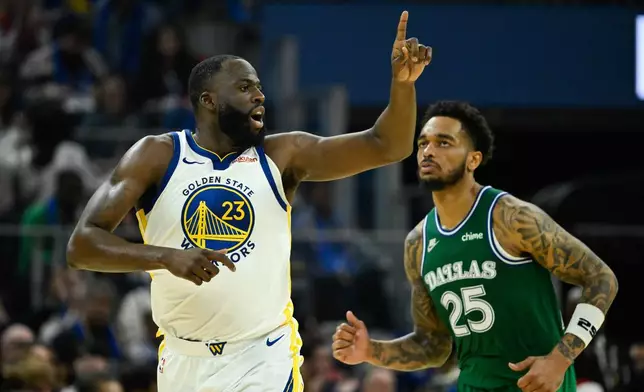 Golden State Warriors forward Draymond Green (23) celebrates a three-point basket against the Dallas Mavericks during the first half of an NBA basketball game, Thursday, Dec. 25, 2025, in San Francisco. (AP Photo/Eakin Howard)