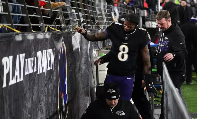 Baltimore Ravens quarterback Lamar Jackson (8) leaves the field during the first half of an NFL football game against the New England Patriots, Sunday, Dec. 21, 2025, in Baltimore. (AP Photo/Nick Wass)