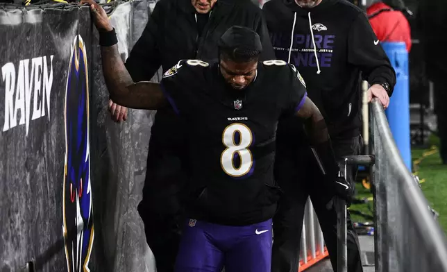 Baltimore Ravens quarterback Lamar Jackson (8) leaves the field during the first half of an NFL football game against the New England Patriots, Sunday, Dec. 21, 2025, in Baltimore. (AP Photo/Nick Wass)