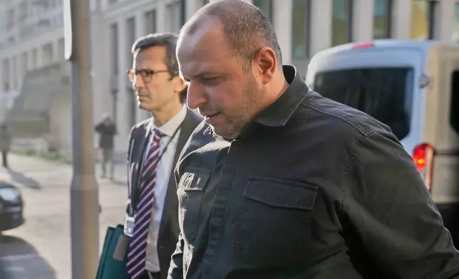 Ukraine's Secretary of National Security Rustem Umerov, right, and Günter Sautter, Foreign and Security Policy Advisor to Chancellor Merz meet in Berlin, Germany, Sunday, Dec. 14, 2025. (AP Photo/Markus Schreiber)