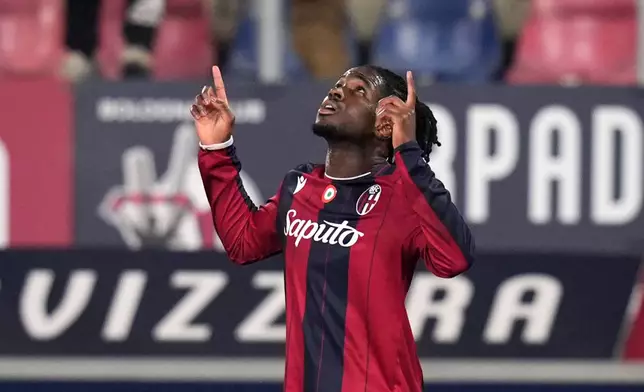 Bologna's Jonathan Rowe celebrates after scoring during the Italian Cup soccer match between Bologna and Parma in Bologna, Italy, Thursday, Dec. 4, 2025. (Massimo Paolone/LaPresse via AP)