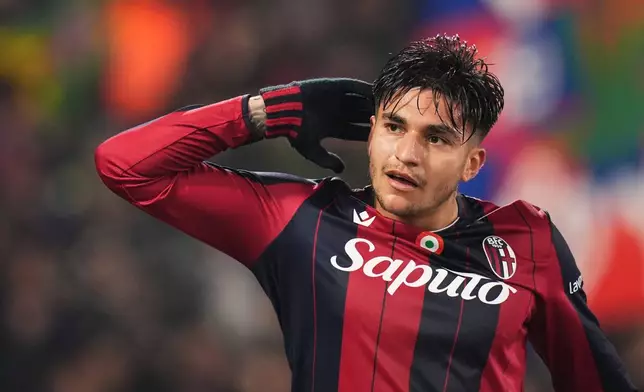 Bologna's Santiago Castro celebrates after scoring his side's second goal during the Italian Cup soccer match between Bologna and Parma in Bologna, Italy, Thursday, Dec. 4, 2025. (Massimo Paolone/LaPresse via AP)