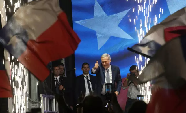 Presidential candidate Jose Antonio Kast, of the opposition Republican Party, celebrates winning the presidential runoff election in Santiago, Chile, Sunday, Dec. 14, 2025. (AP Photo/Esteban Felix)