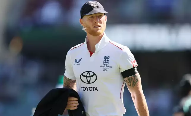 England's Ben Stokes walks after coin toss during play on day one of the third Ashes cricket test between England and Australia at the Adelaide Oval in Adelaide, Australia, Wednesday, Dec. 17, 2025. (AP Photo/James Elsby)