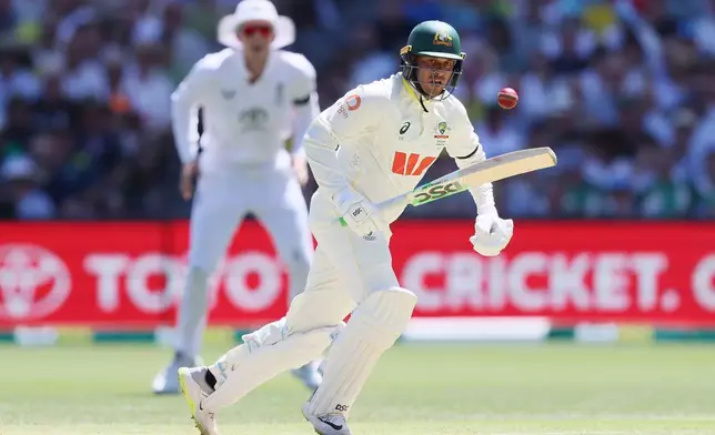 Australia's Usman Khawaja plays a shot during play on day one of the third Ashes cricket test between England and Australia at the Adelaide Oval in Adelaide, Australia, Wednesday, Dec. 17, 2025. (AP Photo/James Elsby)