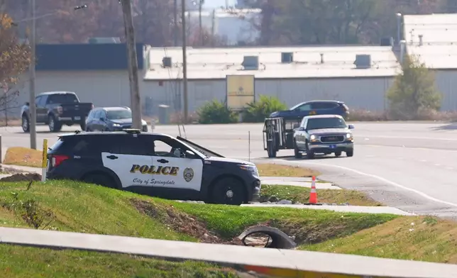 A Springdale, Ark., police officer waits to pull over speeding drivers along Old Missouri Road, Nov. 18, 2025, in Springdale, Ark. (AP Photo/Julio Cortez)