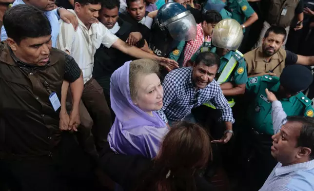 FILE - Bangladesh's former prime minister and Bangladesh Nationalist Party leader Khaleda Zia, center, leaves court after a hearing in Dhaka, Bangladesh, Aug. 10, 2016. (AP Photo, File)