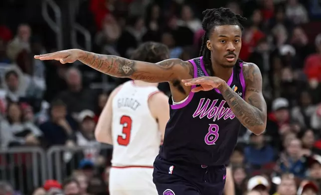 Minnesota Timberwolves' Bones Hyland (8) celebrates after making a 3-point basket during the first half of an NBA basketball game against the Chicago Bulls, Monday, Dec. 29, 2025, in Chicago. (AP Photo/Paul Beaty)