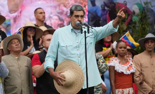 Nicolas Maduro speaks at a rally marking the anniversary of the Battle of Santa Isabel, which took place during Venezuela's 19th-century Federal War, in Caracas, Venezuela, Wednesday, Dec. 10, 2025. (AP Photo/Ariana Cubillos)