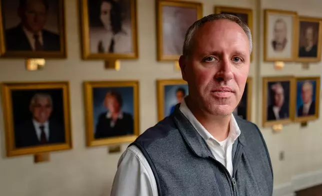 Superintendent Dr. Joshua Matthews sits for a portrait at the Shelby County Public Schools Central Office, Nov. 18, 2025, in Shelbyville, Ky. (AP Photo/Jon Cherry)