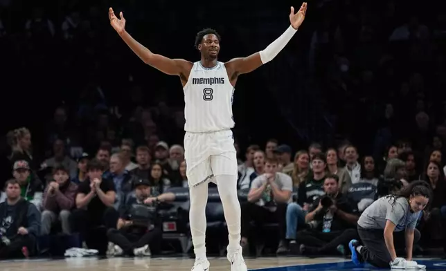Memphis Grizzlies forward Jaren Jackson Jr. (8) looks toward a referee during the first half of an NBA basketball game against the Minnesota Timberwolves, Wednesday, Dec. 17, 2025, in Minneapolis. (AP Photo/Abbie Parr)