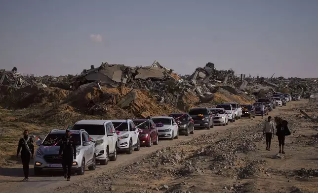 A convoy of Palestinian grooms travels to Hamad City in Khan Yunis, in the Gaza Strip, to take part in a mass wedding ceremony Tuesday, Dec. 2, 2025. (AP Photo/Abdel Kareem Hana)