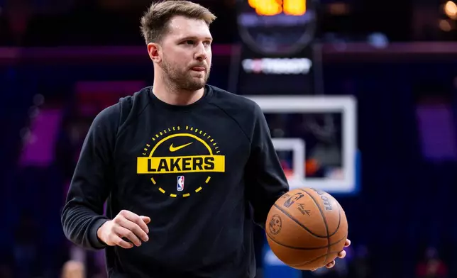 Los Angeles Lakers' Luka Doncic warms up prior to an NBA basketball game against the Philadelphia 76ers, Sunday, Dec. 7, 2025, in Philadelphia. (AP Photo/Chris Szagola)