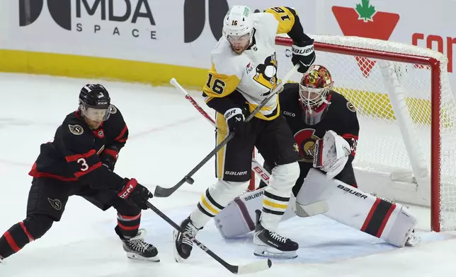 Pittsburgh Penguins' Justin Brazeau (16) tries to tip the puck in front of Ottawa Senators goaltender Linus Ullmark (35) and Nick Jensen (3) during the first period of an NHL hockey game in Ottawa, Ontario, Thursday, Dec. 18, 2025. (Patrick Doyle/The Canadian Press via AP)