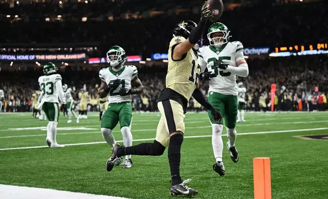 New Orleans Saints wide receiver Chris Olave celebrates after scoring a touchdown during the second half of an NFL football game against the New York Jets, Sunday, Dec. 21, 2025, in New Orleans. (AP Photo/Ella Hall)