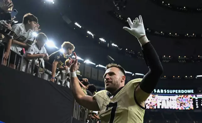 New Orleans Saints tight end Taysom Hill (7) leaves the field after an NFL football game against the New York Jets, Sunday, Dec. 21, 2025, in New Orleans. (AP Photo/Ella Hall)