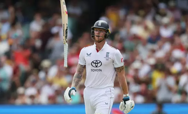 England's Ben Stokes throws his bat as he reacts after he was out bowled during play on day three of the third Ashes cricket test between England and Australia in Adelaide, Australia, Friday, Dec. 19, 2025. (AP Photo/James Elsby)