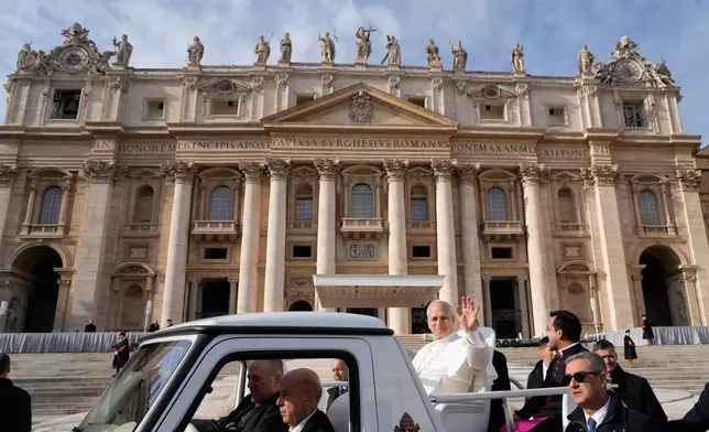 Pope Leo XIV leaves St. Peter's Square at the end of the last Jubilee audience, at the Vatican, Saturday, Dec. 20, 2025. (AP Photo/Gregorio Borgia)