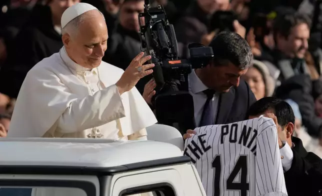 Pope Leo XIV greets faithful as he arrives in St. Peter's Square on the occasion of the last Jubilee audience, at the Vatican, Saturday, Dec. 20, 2025. (AP Photo/Gregorio Borgia)