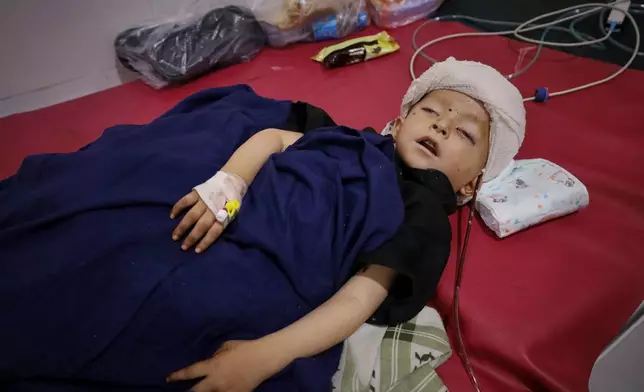 FILE - A boy injured during Sunday's powerful 6.0-magnitude earthquake that struck eastern Afghanistan lies in a hospital bed in Jalalabad, Afghanistan, Tuesday, Sept. 2, 2025. (AP Photo, File)