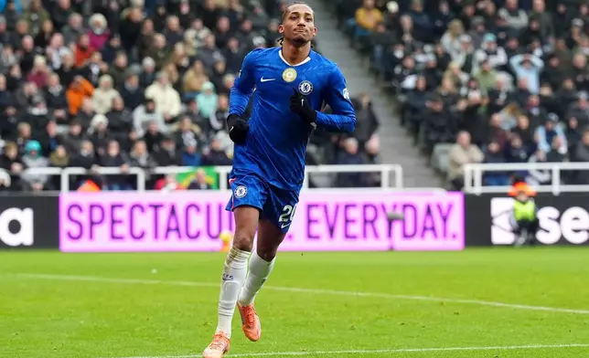 Chelsea's Joao Pedro celebrates after scoring his side's second goal during the English Premier League soccer match between Newcastle United and FC Chelsea in Newcastle, England, Saturday, Dec. 20, 2025. (Owen Humphreys/PA via AP)