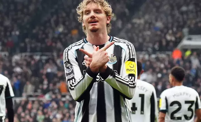 Newcastle's Nick Woltemade celebrates after scoring his side's second goal during the English Premier League soccer match between Newcastle United and FC Chelsea in Newcastle, England, Saturday, Dec. 20, 2025. (Owen Humphreys/PA via AP)