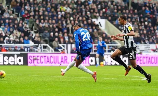 Chelsea's Joao Pedro, left, scores his side's second goal during the English Premier League soccer match between Newcastle United and FC Chelsea in Newcastle, England, Saturday, Dec. 20, 2025. (Owen Humphreys/PA via AP)